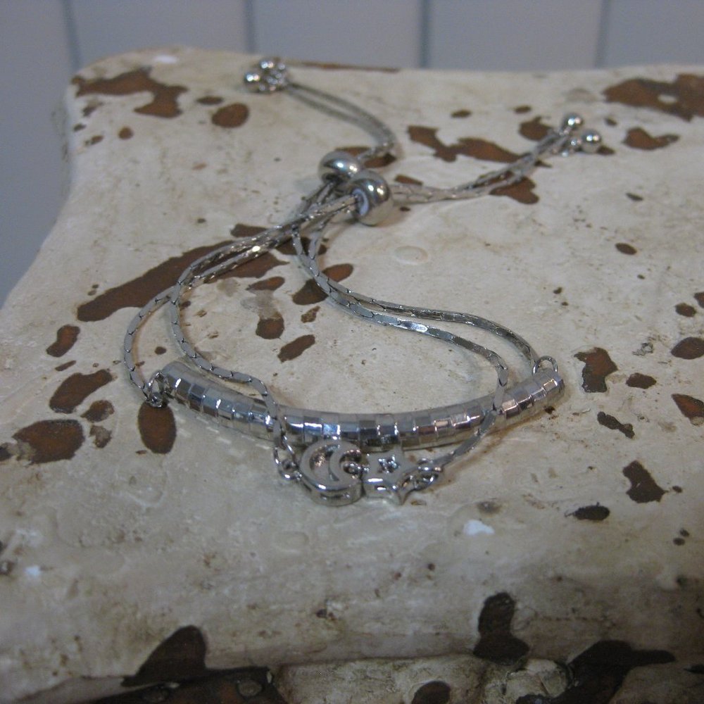 NWOT Guess silver rhinestone moon star charm bracelet set